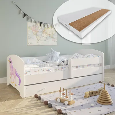 A child's bedroom with a white bed featuring a unicorn motif, bedding, a pull-out drawer, and toys on a rug.