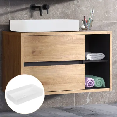 A bathroom vanity with a sink and storage.