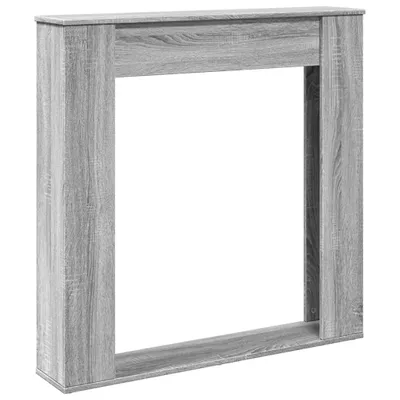 A grey wooden fireplace surround shown from the front.