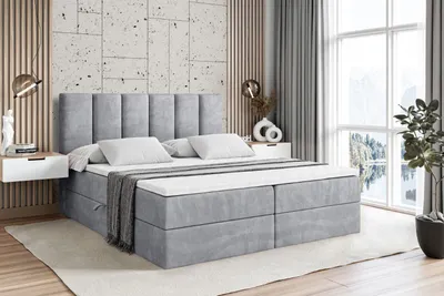 A bedroom scene with a bed, nightstands, and a window.