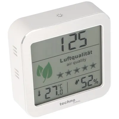 A white digital air quality monitor with a gray metallic frame, displaying various readings and icons.