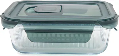 A clear, front-facing studio shot of a glass food storage container with a dark gray lid.