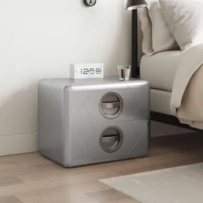 A bedside table next to a bed.