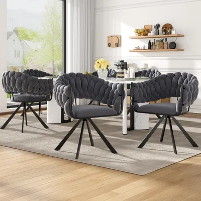 A dining room setting with chairs around a table.