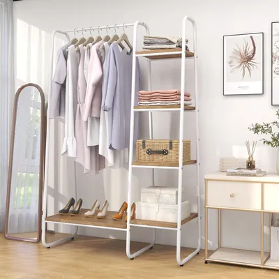 A clothing rack and shelving unit displaying clothes and folded linens.