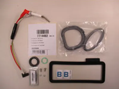 A collection of parts laid out on a light gray surface.