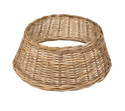 A woven rattan tree skirt on a white background.