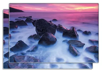 Produktbild von Wallario Frühstücksbrettchen 2er Set aus Glas, je 20 x 30 cm, mit rutschfesten Füßen, Motiv Felsen im Meer bei Sonnenuntergang