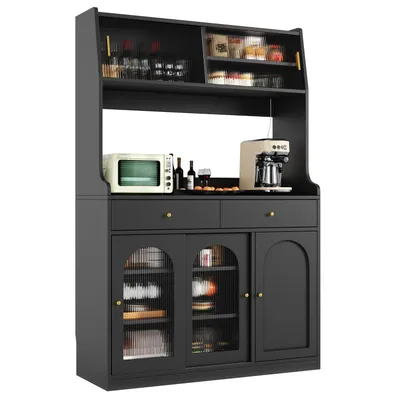 A black kitchen buffet or hutch with glass doors and shelves, featuring a microwave, coffee maker, and various items on display.