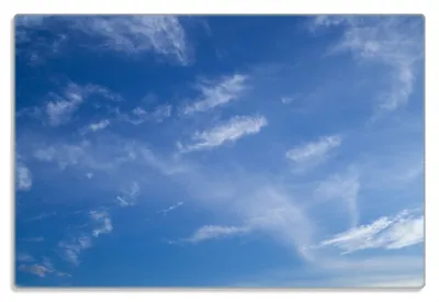 Produktbild von Wallario Frühstücksbrettchen aus Glas 20 x 30 cm mit rutschfesten Füßen, Motiv Blauer Himmel mit vereinzelten Wolken