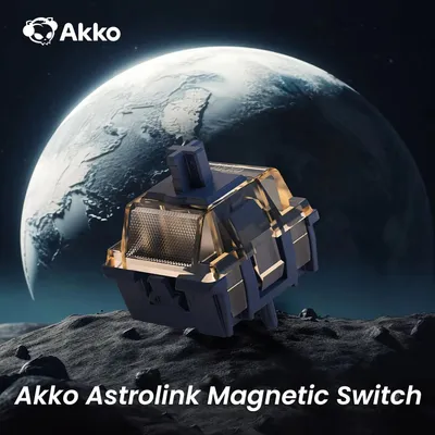 A mechanical keyboard switch is shown in the foreground, with a large planet in the background, set against a dark, rocky terrain.