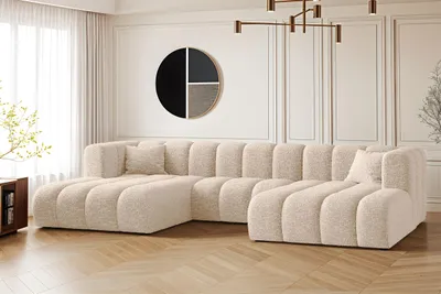 A modern living room with a large U-shaped sectional sofa.