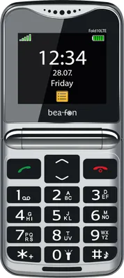 A close-up studio shot of a silver and black flip phone.