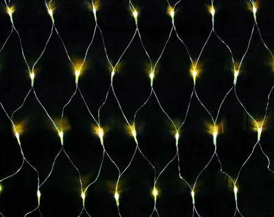 A close-up view of a net of warm white LED lights against a black background.