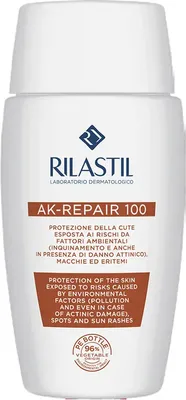 A white bottle of Rilastil AK-REPAIR 100 sunscreen is shown against a white background.