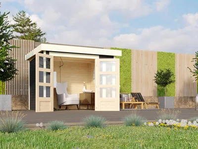 A modern wooden garden shed with glass doors, furnished with a chair and table inside, and lounge chairs outside, set in a garden with green walls and plants.