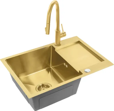 A gold kitchen sink with a faucet and a draining board, set against a white background.