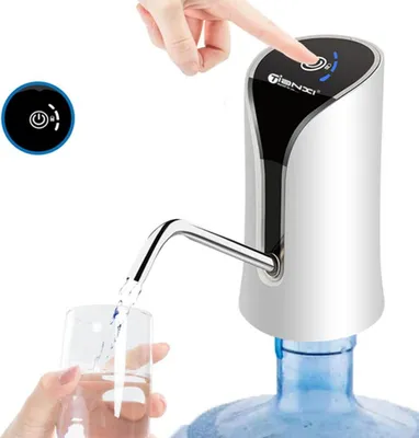 A hand is pressing a button on a white electric water dispenser that is attached to a large water bottle. Water is being dispensed into a glass.