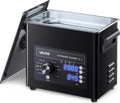 A black ultrasonic cleaner with a digital display and control knob, shown with its lid open.