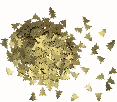 A pile of gold-colored, tree-shaped confetti scattered on a white background.