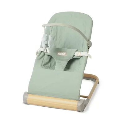A light green baby bouncer with a wooden base.