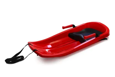 A red plastic sled with a black seat and pull rope, isolated on a white background.
