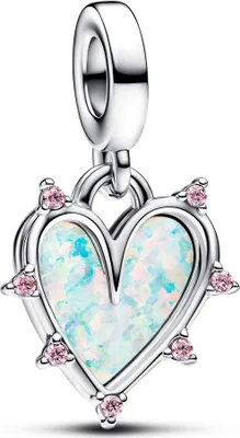A silver charm in the shape of a heart with opalescent inlay and pink stones.
