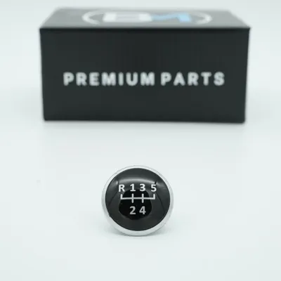 Obrázok produktu pre Kryt páky radenia (5-stupňová prevodovka) s emblémom, kompatibilný s modelmi VW T5, T6, Golf 4, Bora, Polo, Seat, Audi