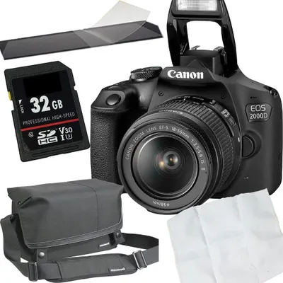 A product shot of a camera kit including a camera, lens, memory card, bag, and cleaning cloth.