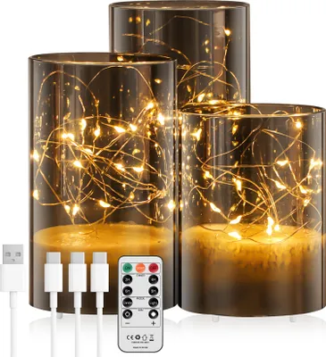 Three LED candles with integrated fairy lights and a remote control are displayed on a white background.