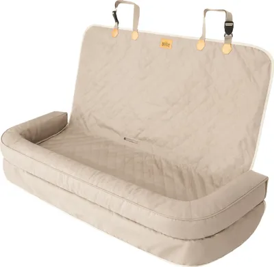 A beige dog car seat cover is shown laid out on a white background.