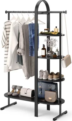 A black garment rack with clothing, shoes, and accessories displayed on it.