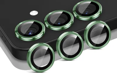 A set of camera lens protectors for a smartphone, arranged on a dark surface.