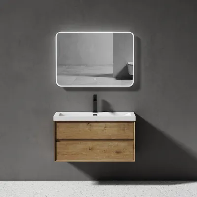 A modern bathroom vanity with a sink and mirror mounted on a gray wall.