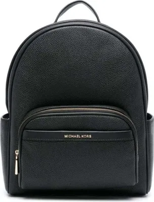 A black Michael Kors backpack is shown from the front against a white background.