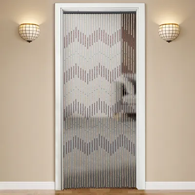 A beaded door curtain hangs in a doorway between two wall sconces.