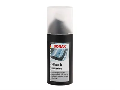 A black bottle of SONAX silicone sealant for seals, with a clear plastic cap, against a white background.