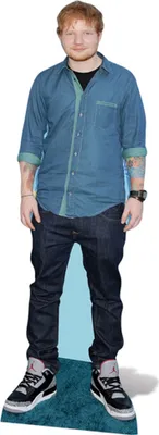 A cardboard cutout of Ed Sheeran standing on a blue carpet.