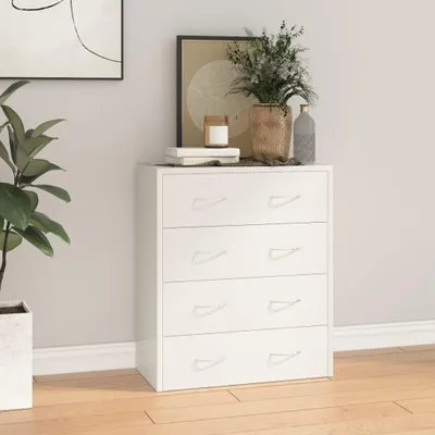 A white dresser with four drawers is shown in a room with a plant and artwork.