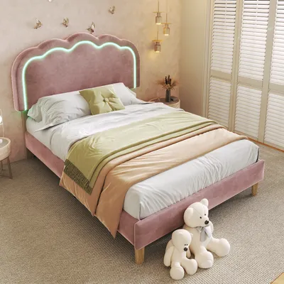 A bedroom scene with a pink velvet bed, bedding, and decorative elements.