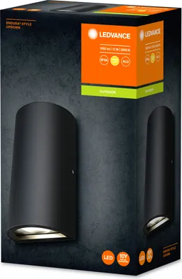 The image shows the packaging of a black LED outdoor wall lamp. The packaging features a dark, textured background with images of the product and branding information.