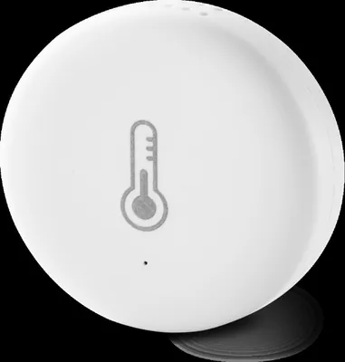 A white, round device with a thermometer icon printed on it, set against a black background.