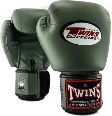 A pair of green boxing gloves on a white background.