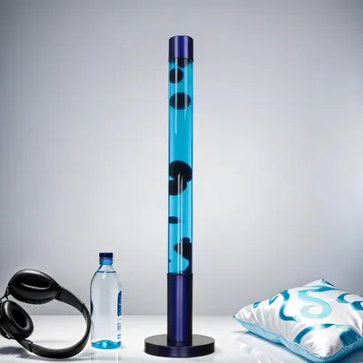 A lava lamp, headphones, and a bottle of water are arranged on a white surface against a light gray background.