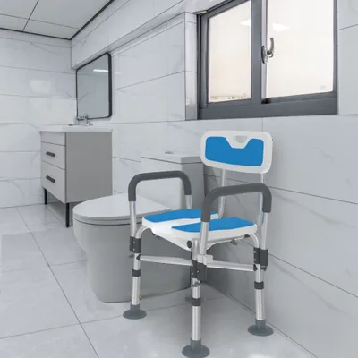 A bathroom with a toilet, sink, and a shower chair.