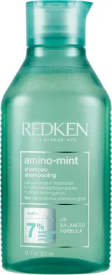 A product shot of a bottle of Redken Amino-Mint Shampoo.