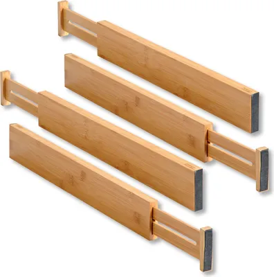 Four adjustable drawer dividers made of wood and gray material.