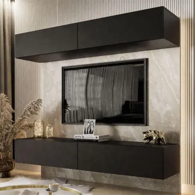A modern living room setup featuring a wall-mounted entertainment unit with a TV and storage.