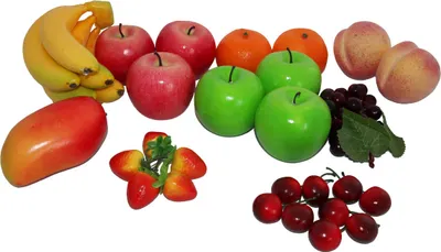 A collection of artificial fruits arranged on a white background.