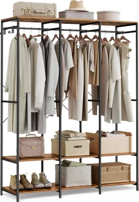 A clothing rack with various garments and storage boxes.